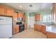 Bright kitchen with tile flooring, light-colored cabinets, and modern appliances at 5960 Wheat Penny Ave, Las Vegas, NV 89122