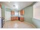 Traditional eat-in kitchen with light-colored cabinets and tile flooring at 5960 Wheat Penny Ave, Las Vegas, NV 89122