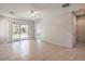 Spacious living room with tile floors and a sliding glass door leading to the backyard at 5960 Wheat Penny Ave, Las Vegas, NV 89122