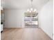 This dining room showcases natural lighting and access to the kitchen and the outdoors at 6121 Iris Cir, Las Vegas, NV 89107