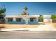 The home's exterior shows a grassy but unkempt lawn and a shed in need of repair at 6121 Iris Cir, Las Vegas, NV 89107