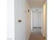 Hallway featuring white walls and doors, plus wood floors at 6121 Iris Cir, Las Vegas, NV 89107
