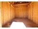 Interior of the backyard shed, featuring wood walls and beams at 6121 Iris Cir, Las Vegas, NV 89107