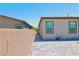 Paver patio next to a brick wall and the side of a house at 6250 Lamont Hills Ave, Las Vegas, NV 89139