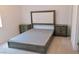 Bedroom featuring neutral carpet, a bed and two nightstands at 6250 Lamont Hills Ave, Las Vegas, NV 89139