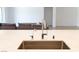 Close-up of a stylish kitchen island featuring a sink and modern fixtures at 6250 Lamont Hills Ave, Las Vegas, NV 89139