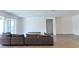 Spacious living room with neutral tones and a sliding glass door at 6250 Lamont Hills Ave, Las Vegas, NV 89139