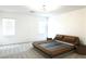 Minimalist main bedroom with a unique bed and neutral color scheme at 6250 Lamont Hills Ave, Las Vegas, NV 89139