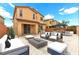 Inviting backyard with stylish patio furniture, a grill, and ample space for outdoor entertaining at 6354 Point Isabel Way, Las Vegas, NV 89122
