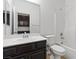 Well-lit bathroom featuring a vanity with a sink and a shower-tub combo at 6354 Point Isabel Way, Las Vegas, NV 89122