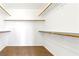 Walk-in closet featuring wooden shelving units and ample storage space at 6354 Point Isabel Way, Las Vegas, NV 89122