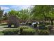 A picturesque community park featuring a rock climbing area and splash pad, surrounded by lush greenery at 6354 Point Isabel Way, Las Vegas, NV 89122