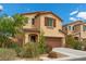 Charming two-story home with a two-car garage and well-maintained landscaping at 6354 Point Isabel Way, Las Vegas, NV 89122