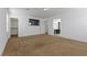 A spacious living room with open layout and a mounted TV at 6354 Point Isabel Way, Las Vegas, NV 89122