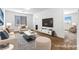 Staged living room featuring a modern design and comfortable seating at 6354 Point Isabel Way, Las Vegas, NV 89122