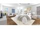 Bright and airy main bedroom with ample natural light, plush bedding, and stylish decor at 6354 Point Isabel Way, Las Vegas, NV 89122