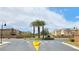 Charming neighborhood entrance with well-maintained landscaping, palm trees, and clear signage at 6354 Point Isabel Way, Las Vegas, NV 89122