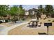 A well-maintained picnic area with tables, benches, and BBQ, perfect for outdoor gatherings at 6354 Point Isabel Way, Las Vegas, NV 89122