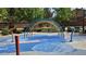 A colorful rainbow-shaped water feature at the splash pad, perfect for outdoor fun and recreation at 6354 Point Isabel Way, Las Vegas, NV 89122
