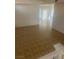 Living room area featuring tile flooring with natural lighting streaming in at 7228 Chic Ave, Las Vegas, NV 89129