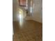 Bright living room featuring tile flooring, high ceilings, and stairway with natural light at 7228 Chic Ave, Las Vegas, NV 89129