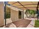 Backyard patio with pergola, brick pavers, and textured exterior at 7924 Horn Tail Ct, Las Vegas, NV 89131