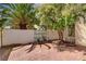 Cozy backyard featuring brick paving, lush trees and greenery, and a serene atmosphere, ideal for private outdoor enjoyment at 7924 Horn Tail Ct, Las Vegas, NV 89131