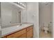 Bathroom with modern vanity, tile floors, and toilet at 7924 Horn Tail Ct, Las Vegas, NV 89131