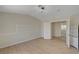 Well-lit bedroom featuring wood floors and access to other rooms at 7924 Horn Tail Ct, Las Vegas, NV 89131