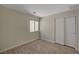 Bright bedroom with wood-look floors, closet, and window at 7924 Horn Tail Ct, Las Vegas, NV 89131