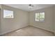 Bedroom with wood-look floors, modern light fixture and bright windows at 7924 Horn Tail Ct, Las Vegas, NV 89131