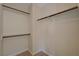 Walk in closet with custom storage, including shelves and rods at 7924 Horn Tail Ct, Las Vegas, NV 89131