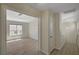 Inviting hallway with light wood floors and access to a room with natural light at 7924 Horn Tail Ct, Las Vegas, NV 89131