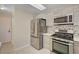 Modern kitchen featuring stainless fridge and gas range at 7924 Horn Tail Ct, Las Vegas, NV 89131