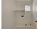 Laundry room features hook ups and a window at 7924 Horn Tail Ct, Las Vegas, NV 89131