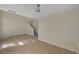 Open-concept living area with staircase and wood-look flooring at 7924 Horn Tail Ct, Las Vegas, NV 89131