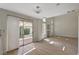 Bright living room features wood floors, backyard access, and decorative chandelier at 7924 Horn Tail Ct, Las Vegas, NV 89131