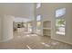 Open-concept living area with plenty of natural light, modern floors, and seamless access to the kitchen at 7924 Horn Tail Ct, Las Vegas, NV 89131