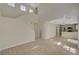 Open floor plan showcasing modern flooring and staircase adjacent to kitchen with stainless steel appliances at 7924 Horn Tail Ct, Las Vegas, NV 89131