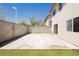 Spacious backyard featuring a concrete patio and a patch of artificial turf, ideal for relaxation at 795 Kiska Ave, Las Vegas, NV 89123