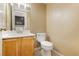 Bathroom featuring a vanity with sink, a toilet, and neutral color palette at 795 Kiska Ave, Las Vegas, NV 89123
