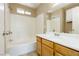 Bathroom featuring a tub-shower combination, vanity, and neutral color palette at 795 Kiska Ave, Las Vegas, NV 89123