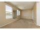 Spacious bedroom featuring plush carpeting, large windows, and neutral color palette at 795 Kiska Ave, Las Vegas, NV 89123