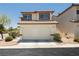 Charming two-story home features a two-car garage and neutral-toned stucco exterior at 795 Kiska Ave, Las Vegas, NV 89123