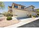 Charming two-story home features a two-car garage and neutral-toned stucco exterior at 795 Kiska Ave, Las Vegas, NV 89123