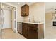 Kitchen area with stainless steel dishwasher and easy access to living area at 795 Kiska Ave, Las Vegas, NV 89123