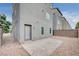 Backyard patio area with low-maintenance desert landscaping and secure fencing at 8056 Haywood Estate Ave, Las Vegas, NV 89113