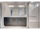 Bathroom vanity with dual sinks, modern fixtures and a glass-enclosed shower at 8056 Haywood Estate Ave, Las Vegas, NV 89113