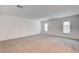 Spacious bedroom with neutral carpeting, crisp white walls, and bright natural light at 8056 Haywood Estate Ave, Las Vegas, NV 89113