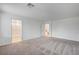 Large bedroom featuring neutral carpet and access to the en suite bathroom at 8056 Haywood Estate Ave, Las Vegas, NV 89113